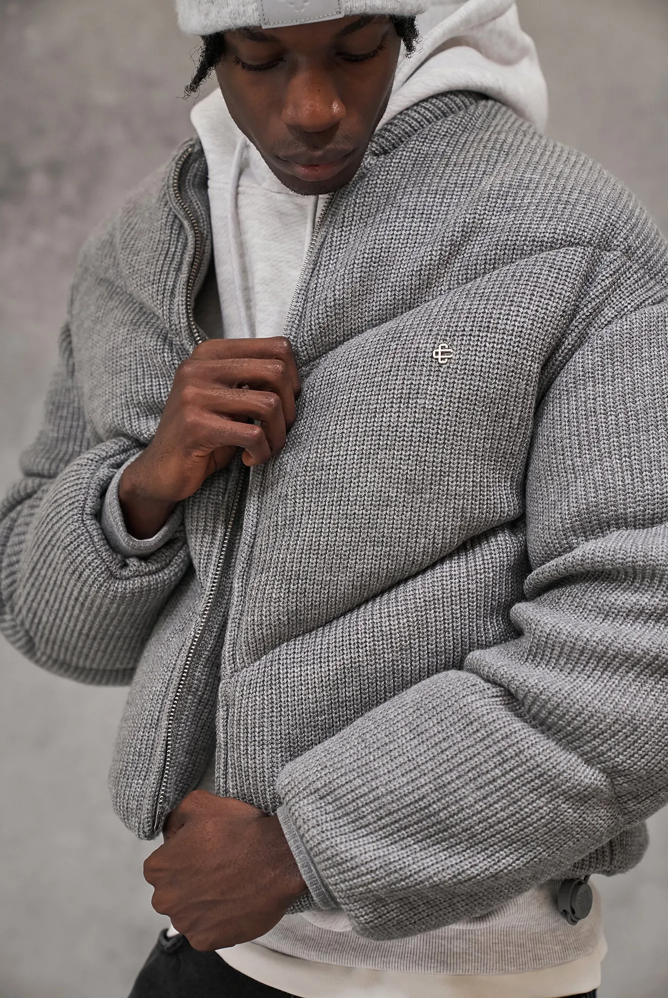 KNITTED CHEVRON PANELLED PUFFER COAT - GREY MARL